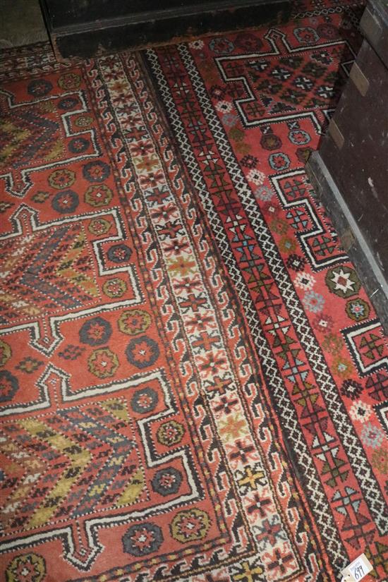 2 similar Kazak style rugs(-)